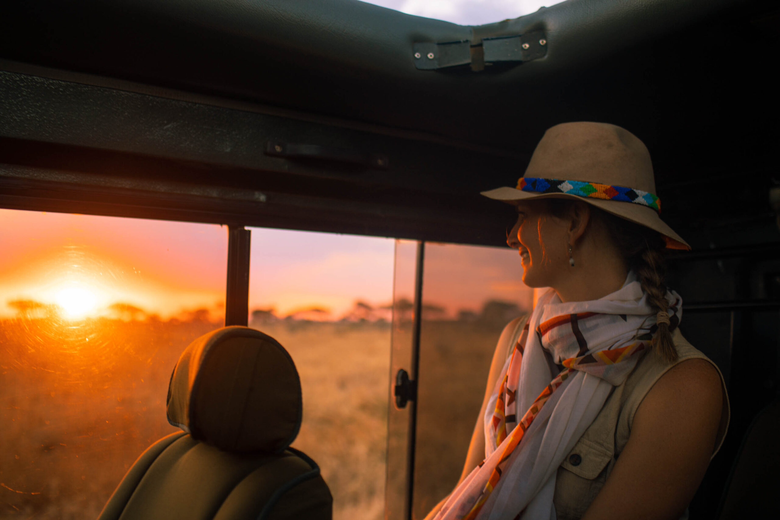 A lady in a safari car