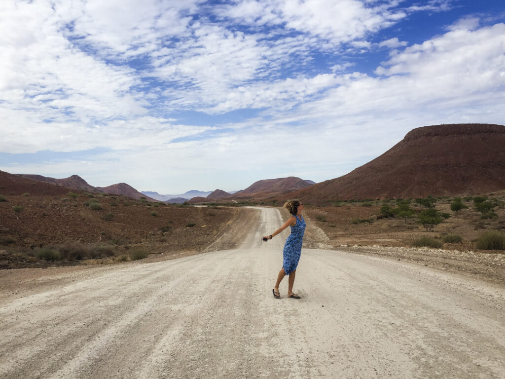 A lady standing in the road in Namibia 